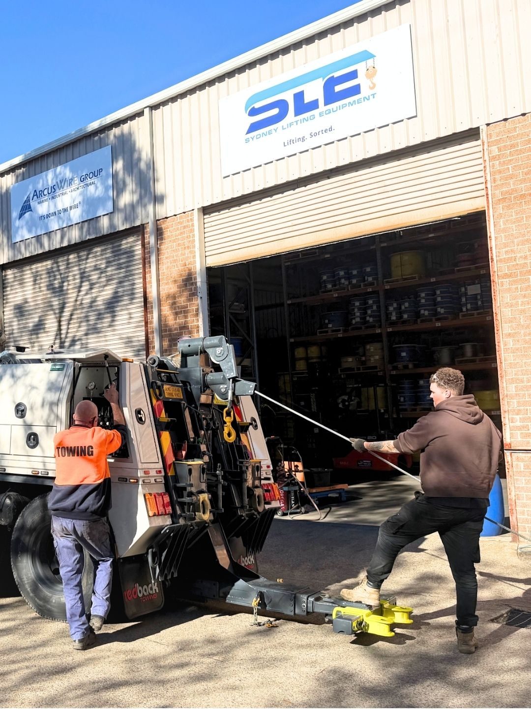 An SLE technician replacing a winch cable at the Mount Kuring-gai workshop